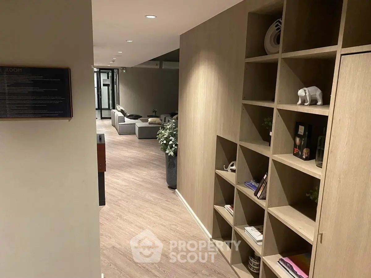 Modern interior with stylish shelving and cozy seating area, perfect for relaxation.