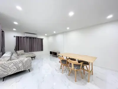 Spacious modern living room with elegant furniture and bright lighting
