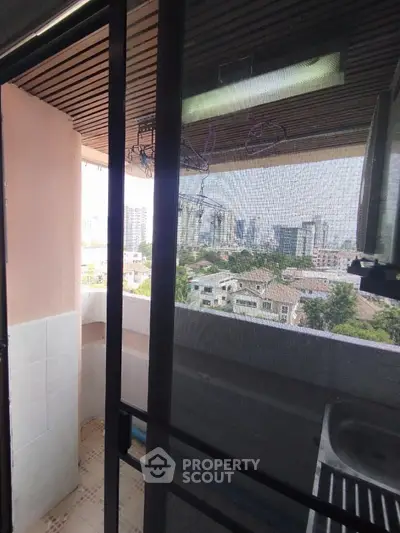 Charming balcony with city view, perfect for relaxation and enjoying urban skyline.