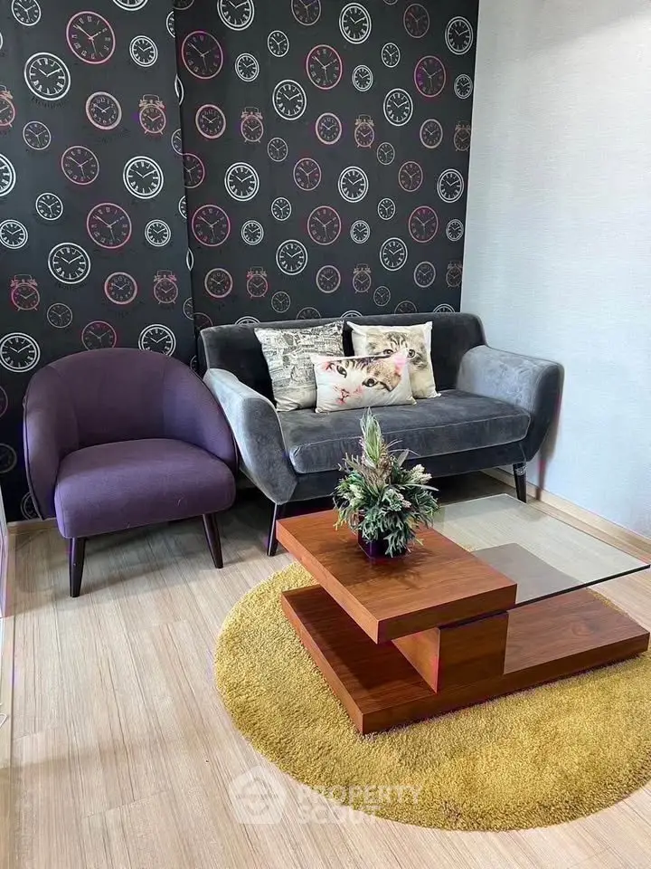 Stylish living room with modern furniture and unique clock-themed wallpaper.