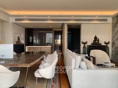 Luxurious modern living room with elegant dining area and open kitchen layout, featuring stylish decor and ample natural light.