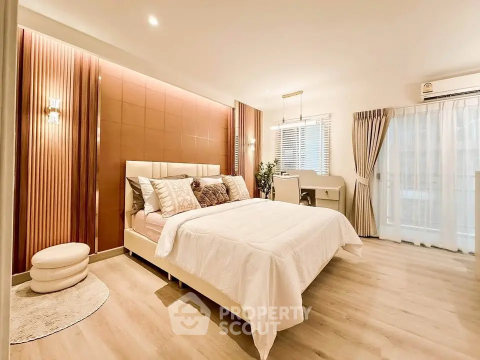 Luxurious bedroom with elegant decor and natural light