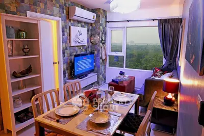 Charming living room with dining area, scenic view, and modern decor in cozy apartment.