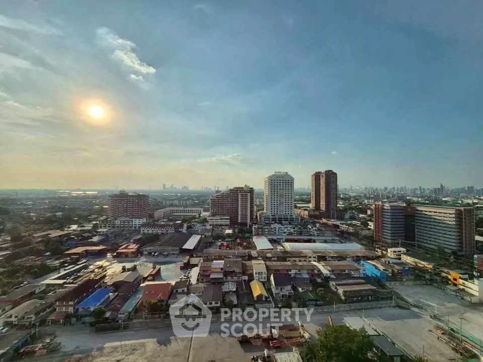 Stunning cityscape view from high-rise building with clear skies and urban skyline.