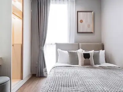 Modern bedroom with stylish decor and natural light
