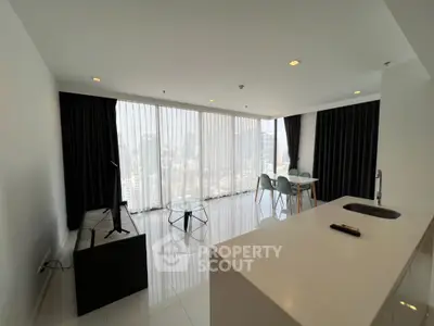Spacious modern living room with city view, elegant dining area, and sleek design.