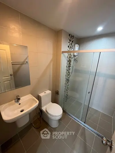 Modern bathroom with glass shower and sleek fixtures