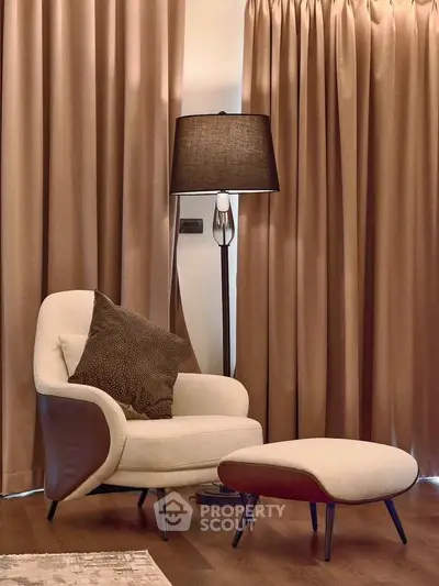 Elegant living room corner with cozy armchair and stylish lamp