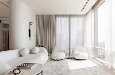 Luxurious modern living room with panoramic city views and elegant white furnishings.