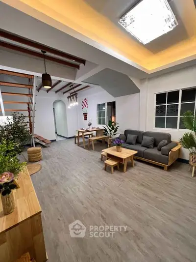 Spacious modern living room with stylish wooden furniture and elegant lighting