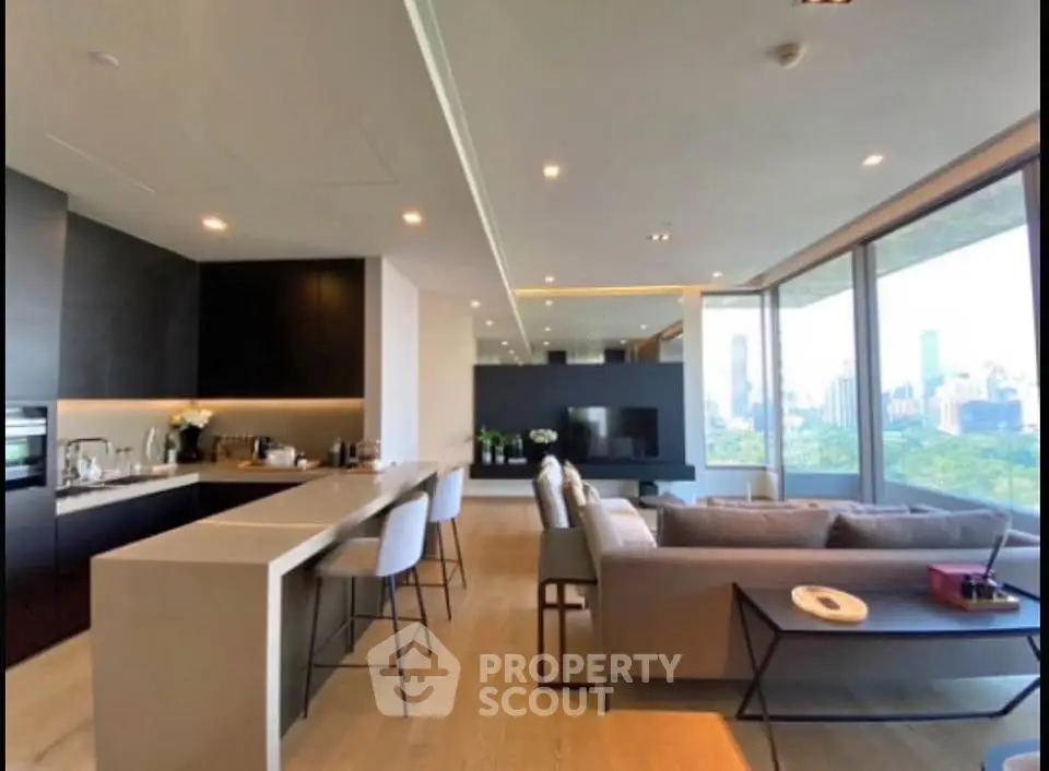 Luxurious open-plan living room with panoramic city views and modern kitchen.