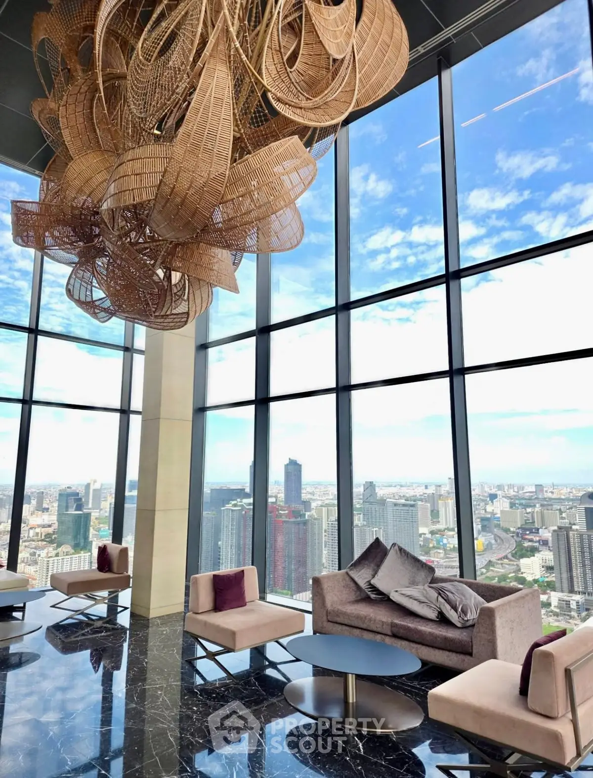Luxurious high-rise lounge with panoramic city views and elegant decor