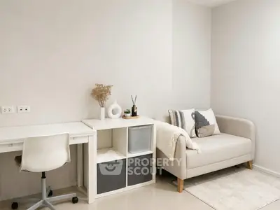 Modern study room with sleek desk and cozy sofa, perfect for productivity and relaxation.