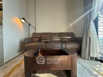 Modern living room with stylish sofa and innovative lift-top coffee table, perfect for urban living.