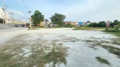 Spacious vacant land in a suburban area, ideal for development opportunities.