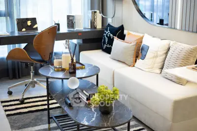 Stylish modern living room with chic decor and cozy seating area, perfect for relaxation and entertaining.