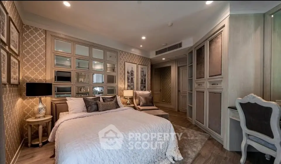 Luxurious bedroom with elegant decor and plush furnishings in a modern apartment.