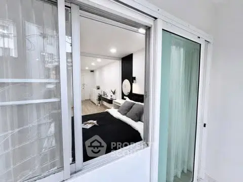 Modern bedroom with sliding glass doors and elegant decor