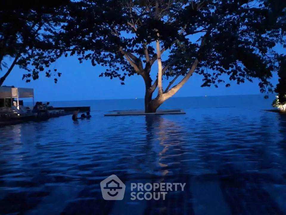 Stunning infinity pool with ocean view at dusk, perfect for luxury relaxation.