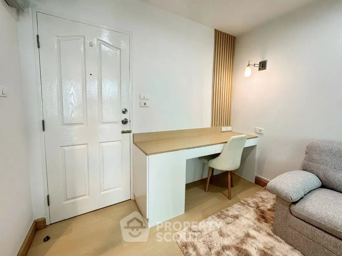 Cozy study nook with modern desk and chair in a stylish apartment interior.