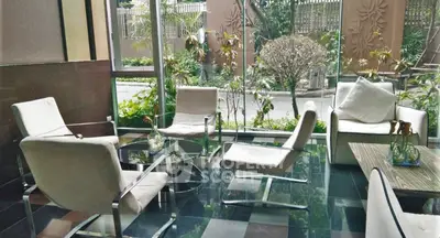 Elegant lobby with modern seating and garden view