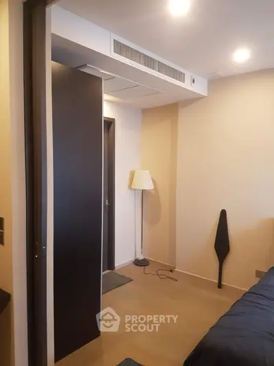 Modern bedroom with sleek design and ambient lighting