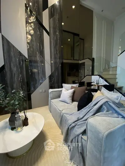 Luxurious modern living room with stylish decor and high ceilings