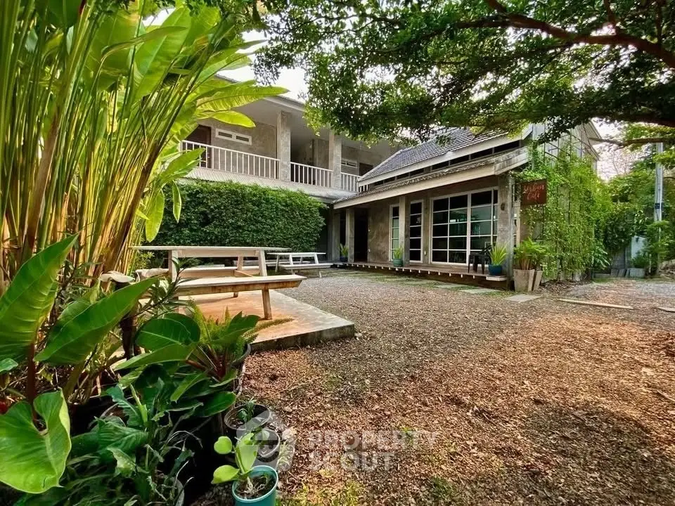 Charming rustic home with lush garden and spacious outdoor area, perfect for relaxation and gatherings.