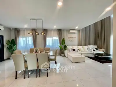 Spacious modern living room with elegant dining area and stylish decor