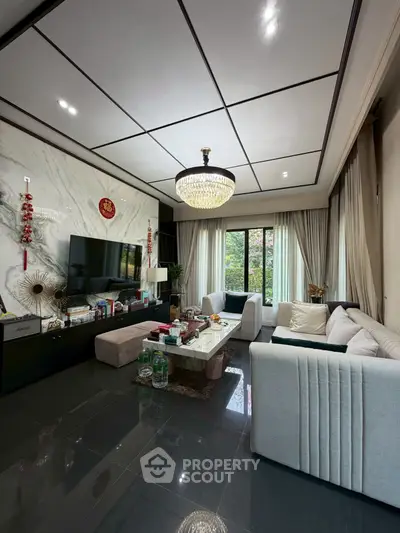 Luxurious living room with elegant chandelier and modern decor