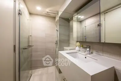 Modern bathroom with sleek design and glass shower enclosure