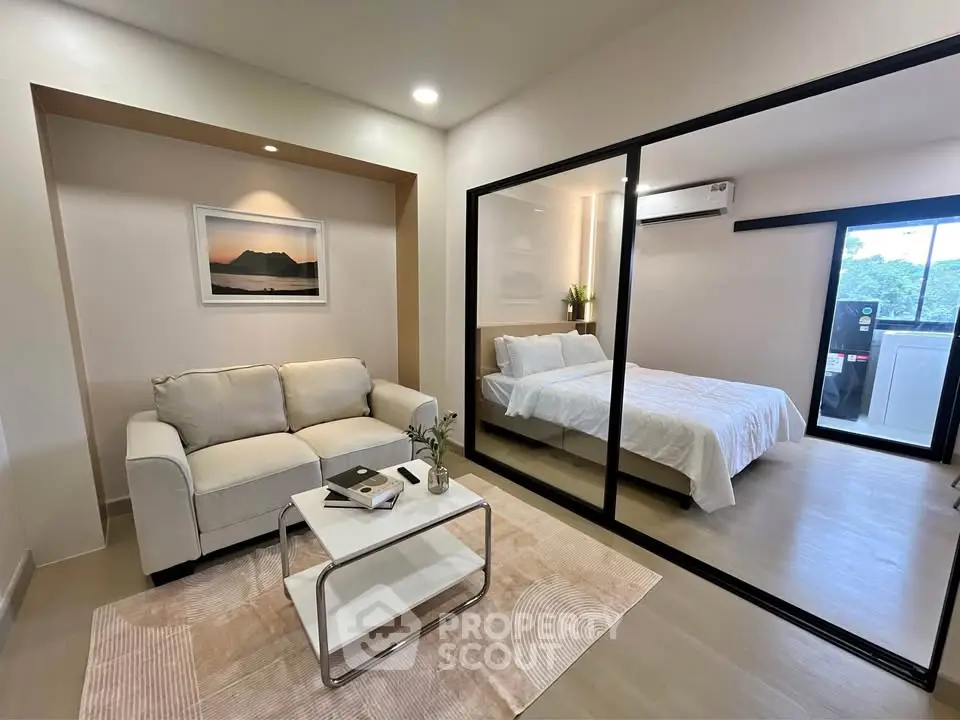 Modern studio apartment with glass partition and cozy living area