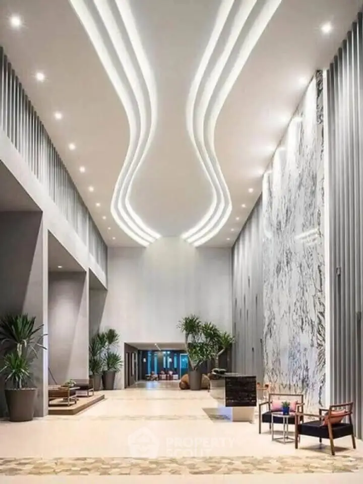 Luxurious modern building lobby with high ceilings and elegant marble wall