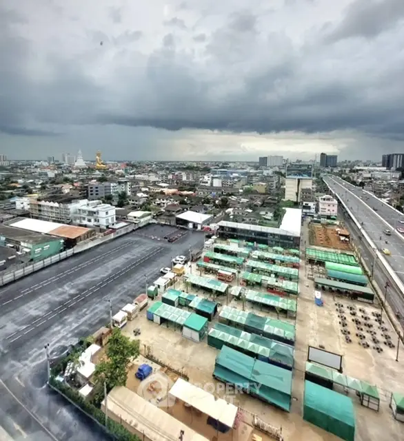 Stunning cityscape view from high-rise building with expansive skyline and vibrant urban landscape.