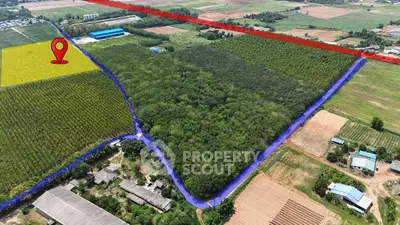 Aerial view of expansive farmland with highlighted boundaries and lush greenery.