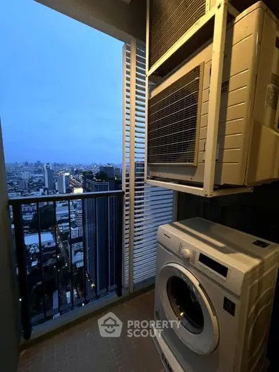 High-rise balcony with city view and washing machine, perfect for urban living.