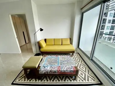 Modern living room with stylish yellow sofa and large window view