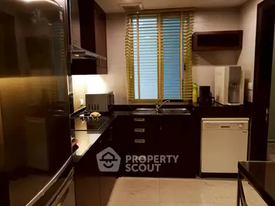 Modern kitchen with sleek appliances and stylish cabinetry, perfect for culinary enthusiasts.