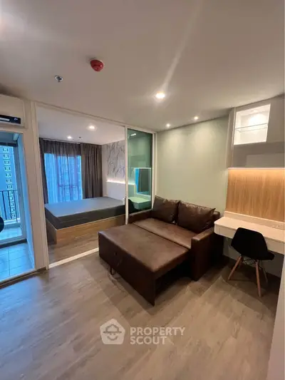 Modern studio apartment with cozy living area and stylish bedroom
