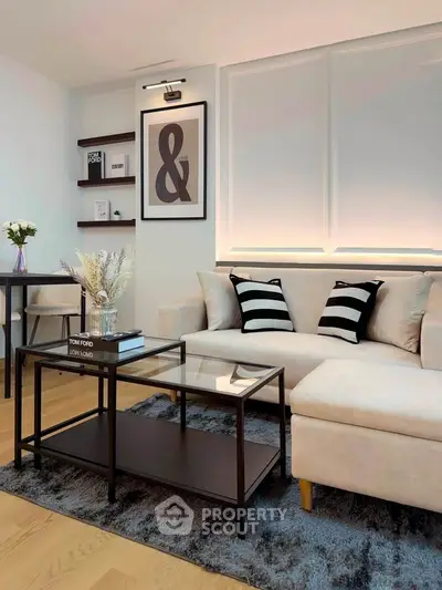 Stylish modern living room with elegant decor and cozy seating area.