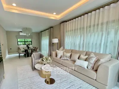 Luxurious living room with elegant decor and spacious dining area, perfect for modern living.