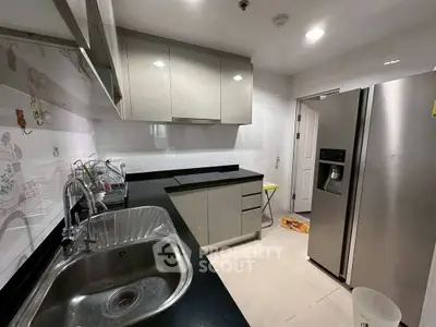 Modern kitchen with sleek cabinetry and stainless steel appliances