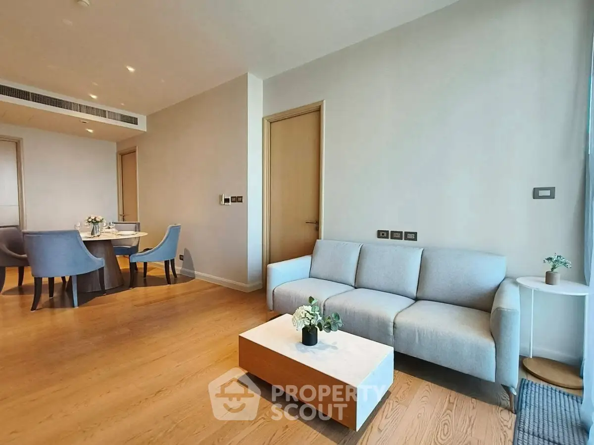 Modern living room with elegant dining area and cozy sofa