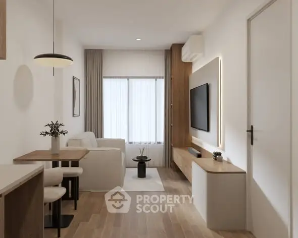 Modern living room with sleek furniture and natural light, featuring a wall-mounted TV and stylish decor.