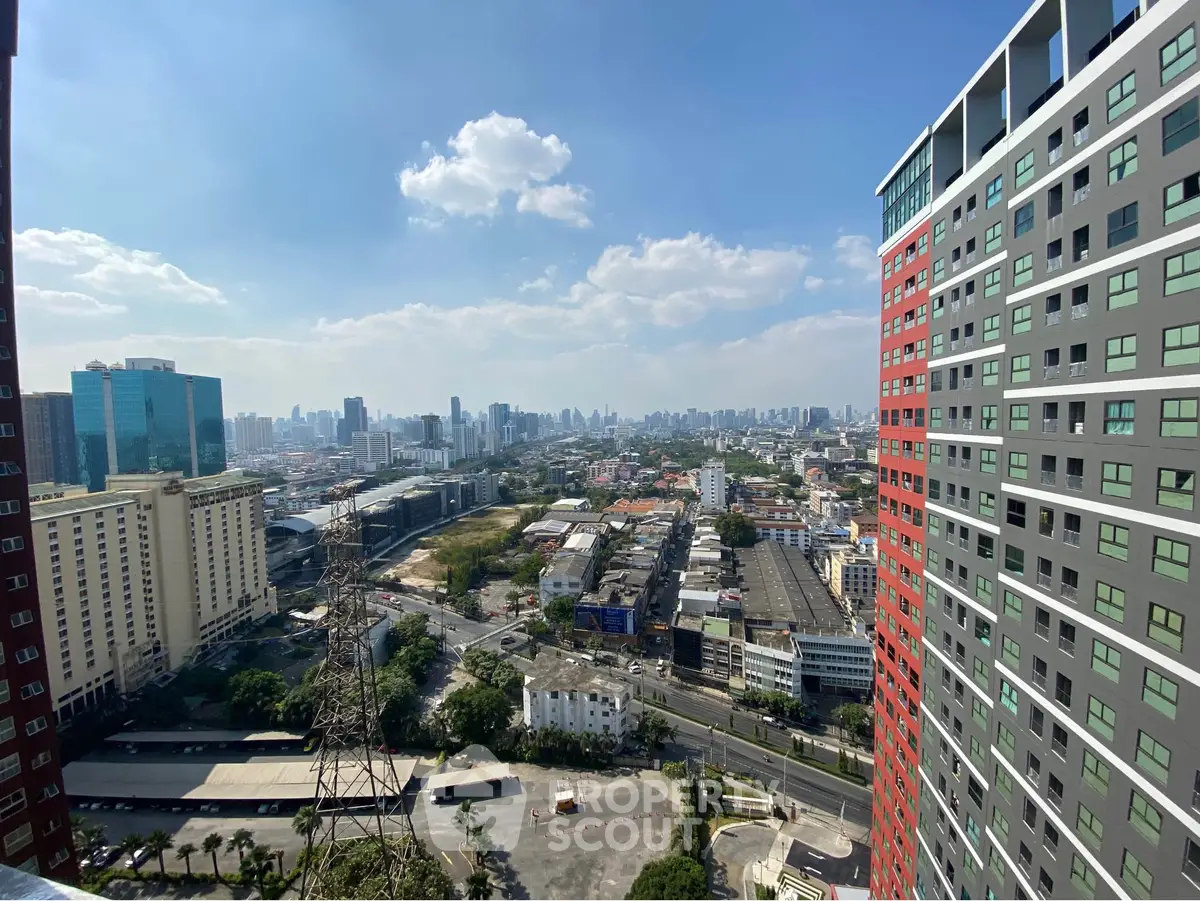 Stunning cityscape view from high-rise building with clear blue sky