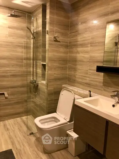 Modern bathroom with glass shower and sleek fixtures