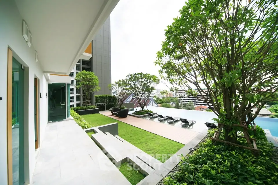 Luxurious rooftop garden with pool and city view, perfect for relaxation and entertainment.