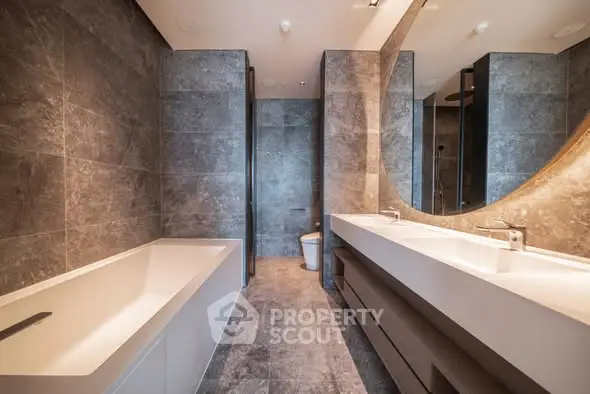 Luxurious modern bathroom with elegant fixtures and spacious design