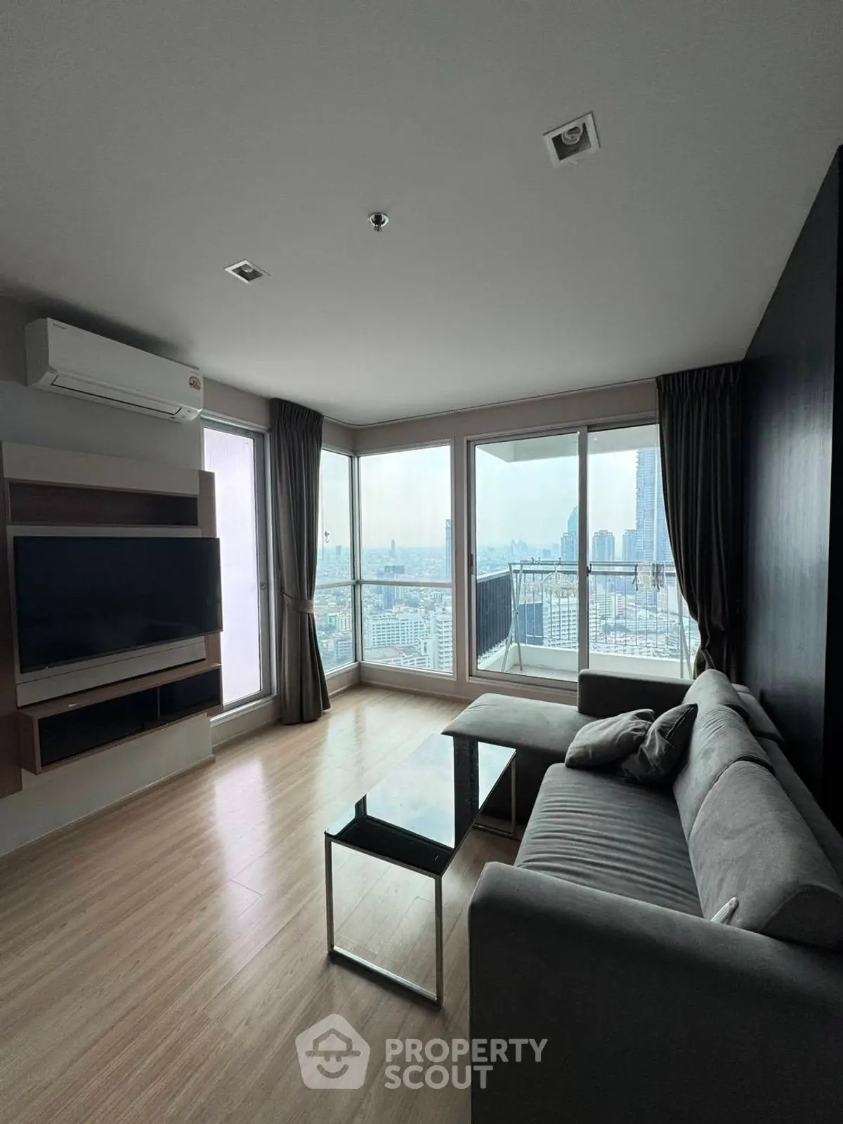 Modern living room with panoramic city view and stylish furniture