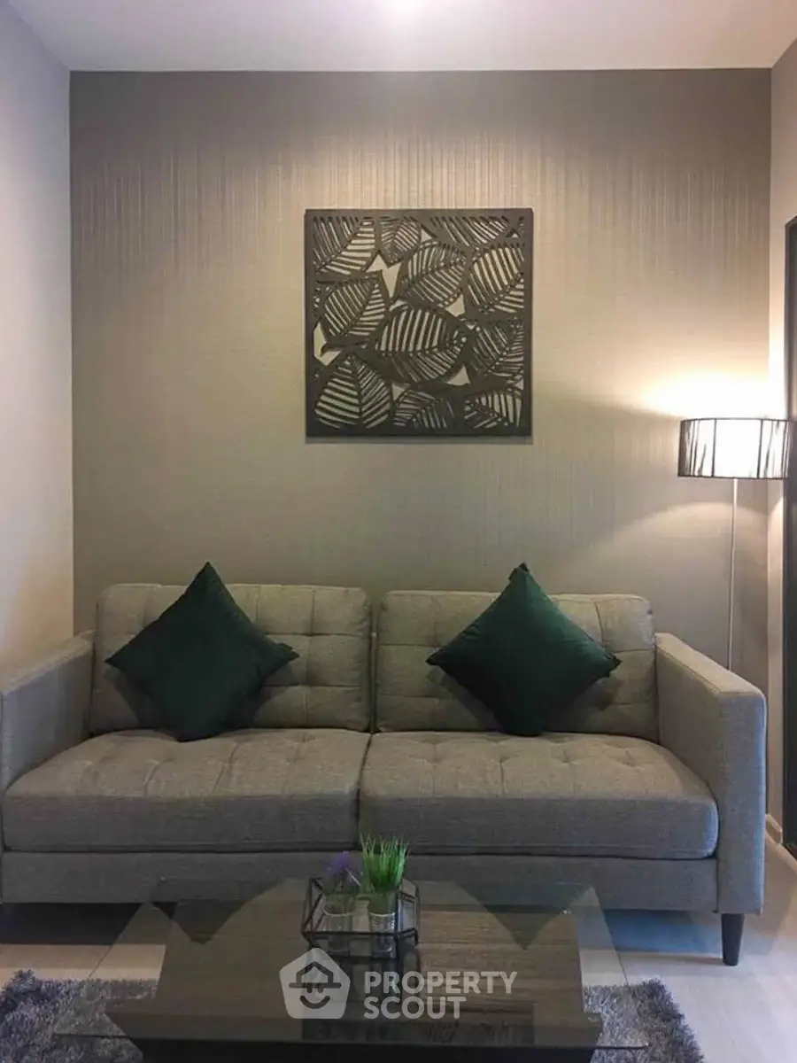 Stylish living room with modern sofa and elegant decor, perfect for cozy relaxation.